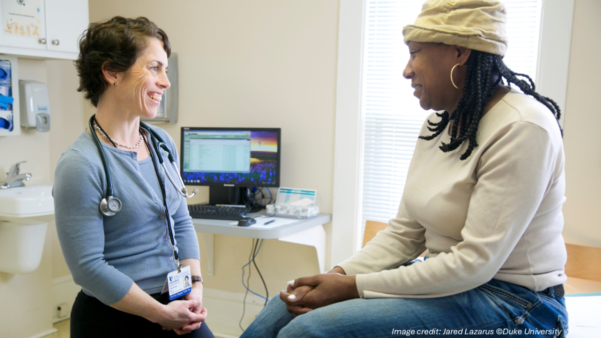 A physician assistant talks with a patient