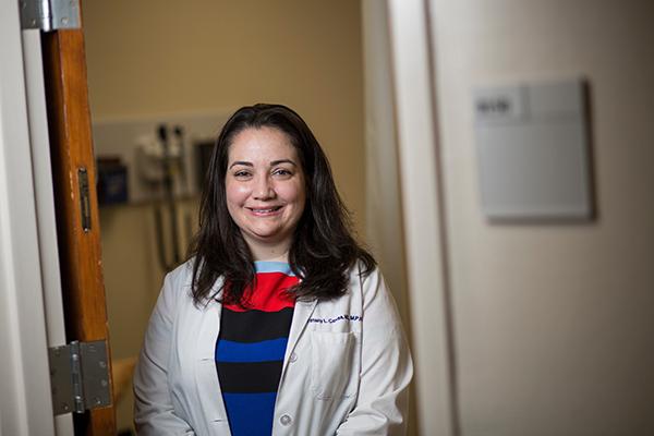 female doctor standing in a doorway