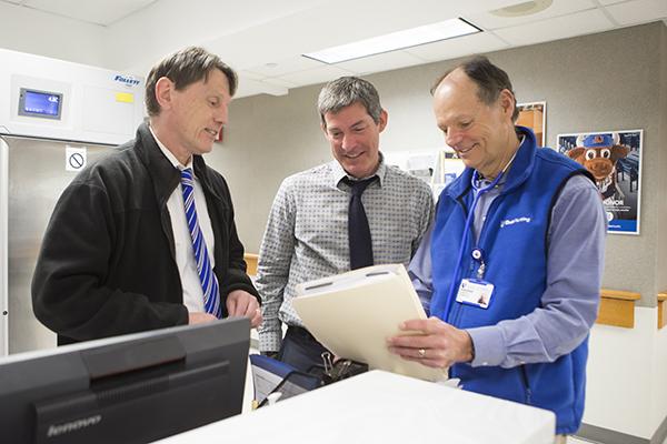 three clinic staff at employee health clinic talk