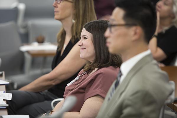 group of fellows at orientation listening to a presentation