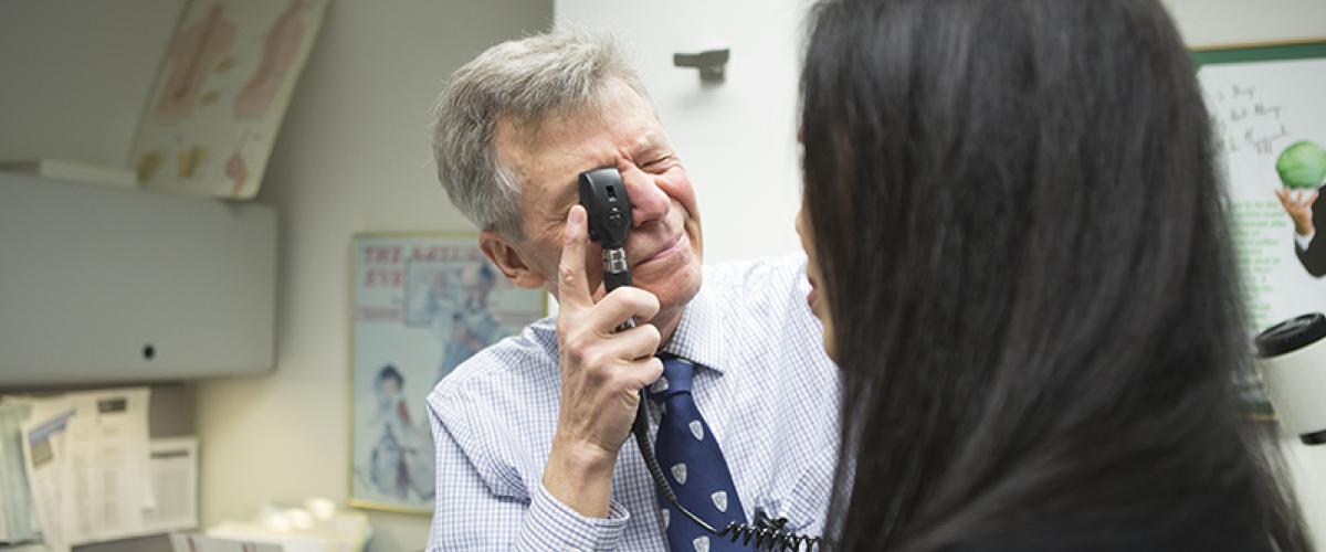 doctor examining patient