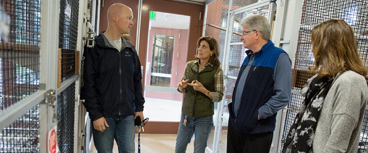 four people talking at the lemur center