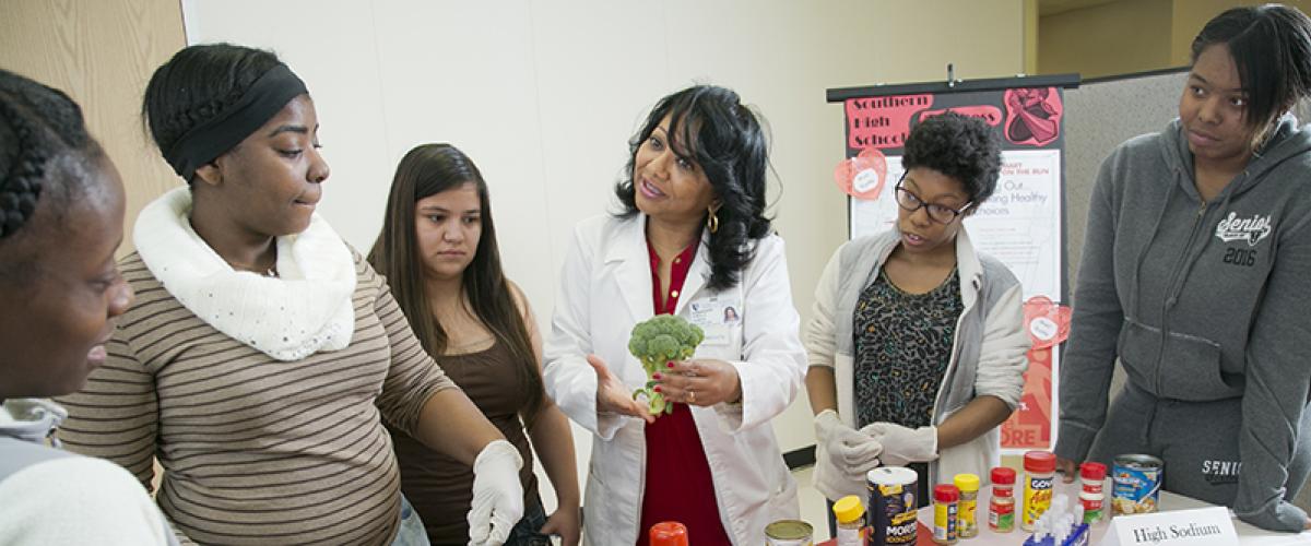 nutritionist talks to group of high school students
