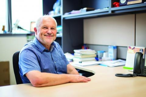 man sitting at his desk