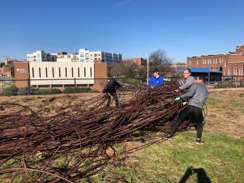 Volunteers assist with clean-up and preparation efforts for the Bull City Community Garden.