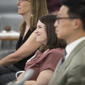 group of fellows at orientation listening to a presentation